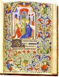 A miniature of the Annunciation from a French Book of Hours showing very elaborate manuscript illumination.
