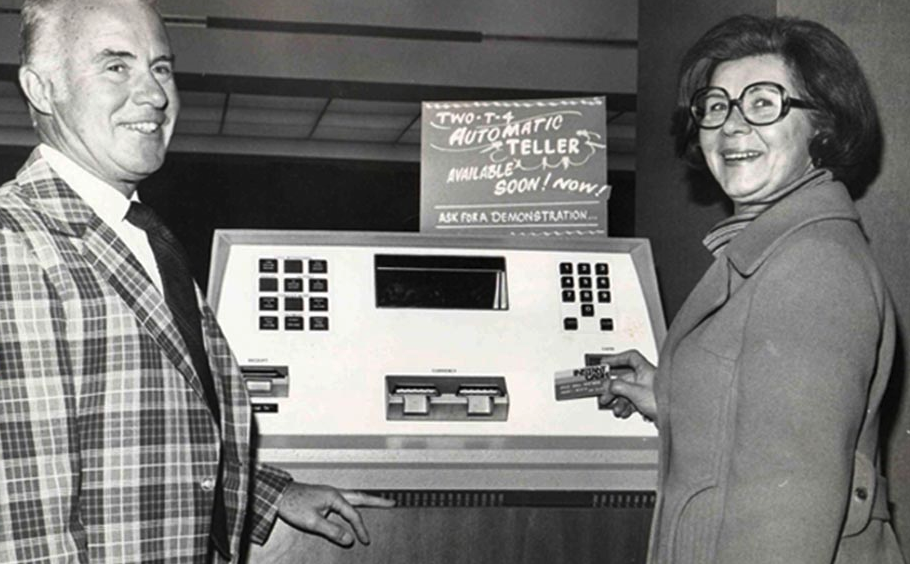 People using an early ATM at Central Northwestern National Bank in 1976.