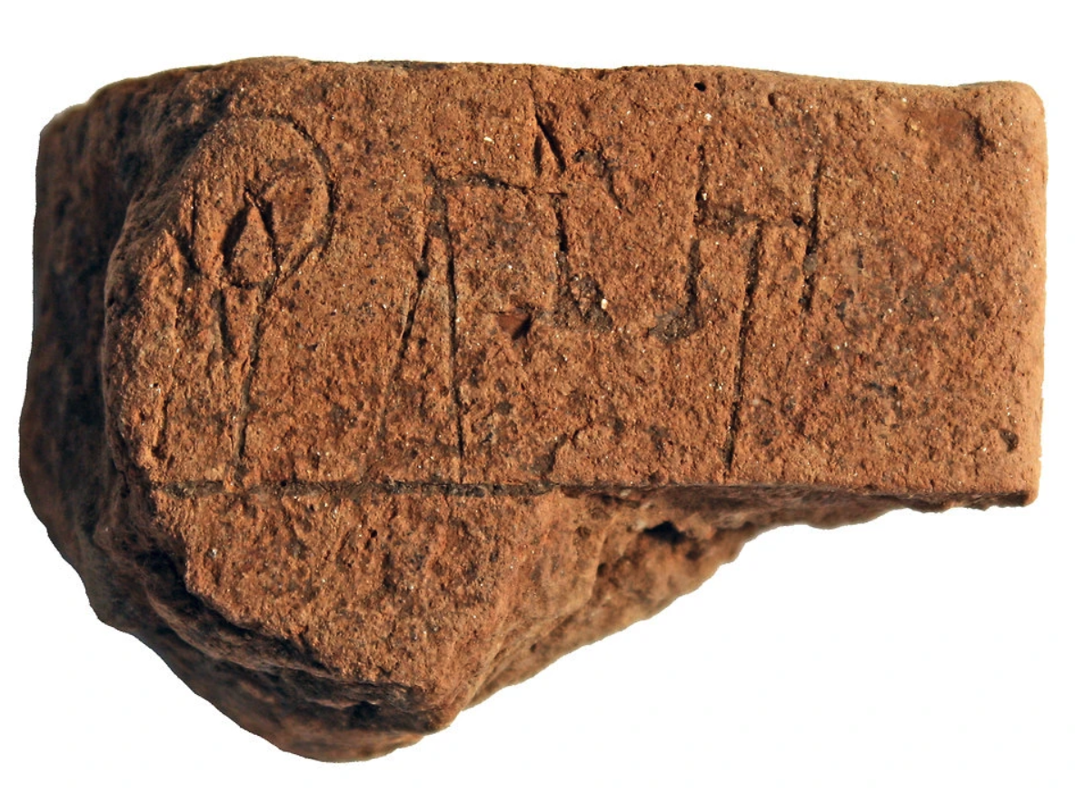 The tablet written in Linear B script is only 2 inches by 3 inches, and includes a list of names alongside numbers. Photo by Christian Mundigler.
