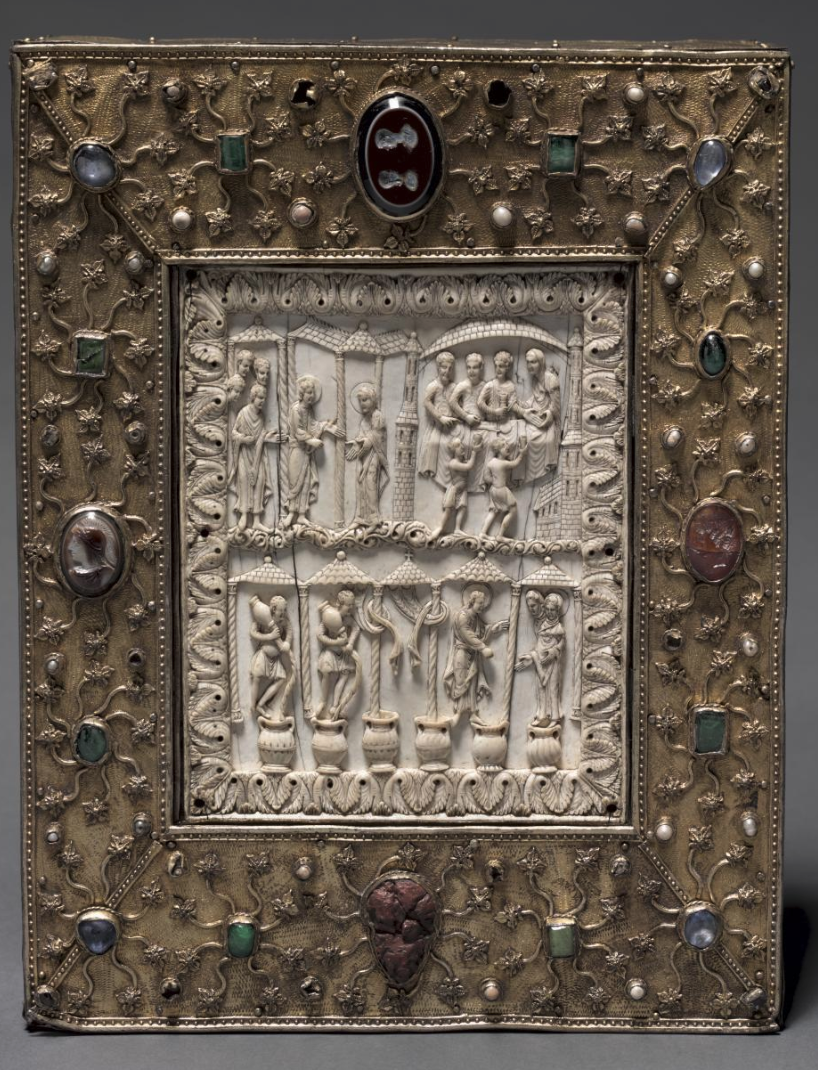 "This sumptuous object closely resembles a deluxe medieval book cover in both form and decoration. It was likely commissioned by Otto the Mild, Duke of Saxony (reigned 1318–48) around 1340. It was made to contain a leaf from each gospel and relics of the 11,000 virgins and 4 other saints. These relics were originally kept in a cavity behind the delicately carved ivory plaque depicting scenes from the Wedding at Cana (John 2:1–11). The story of Christ