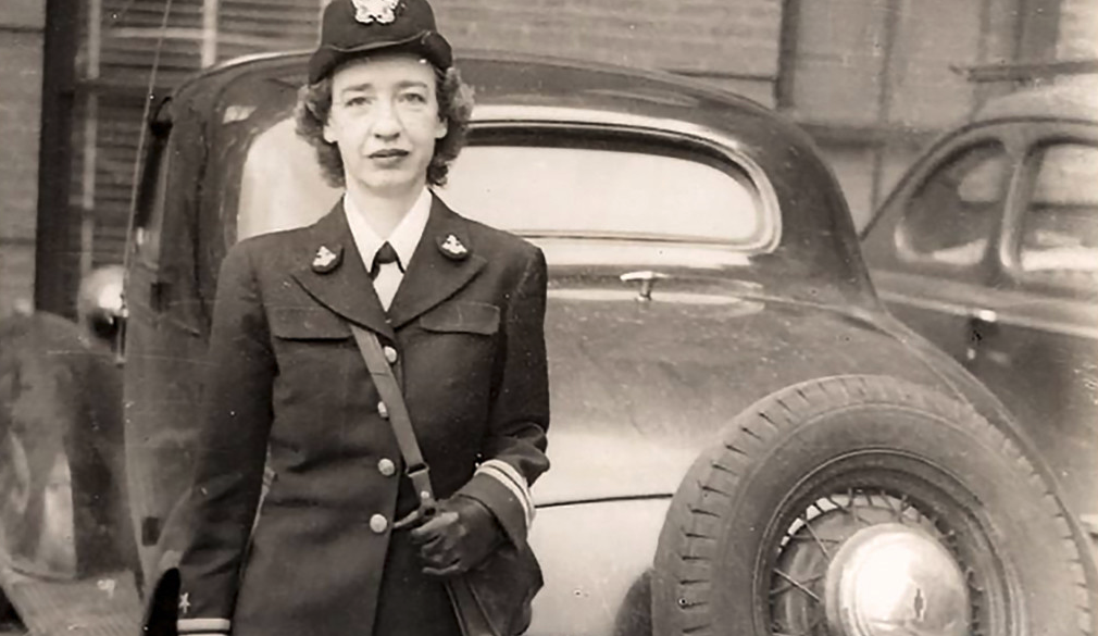 Hopper standing behind a car parked near Cruft Lab, Harvard University, ca. 1945–1947, where she worked on the Mark I computer.
