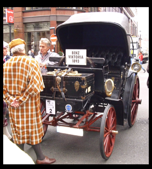 A restored Benz Victoria. The sign indicates that it is a 1893 model.