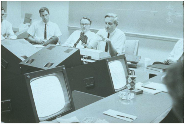 Don Andrews, Bill English, and Doug Engelbart at SRI's Augmentation Research Center during a meeting with sponsors of the program.  Each participant had access to a display and a mouse. 