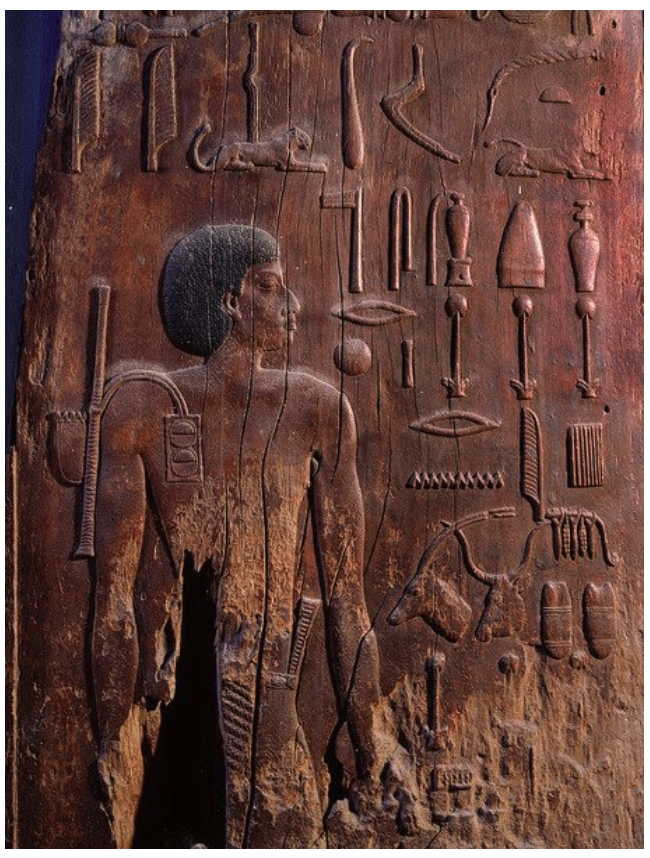 Wooden panel of Hesy-Ra showing all the instruments that he used, including writing instruments.