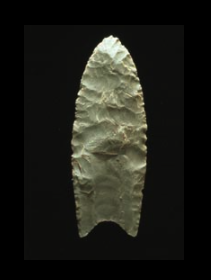 A Clovis projectile point created using bifacial percussion flaking (that is, each face is flaked on both edges alternately with a percussor)