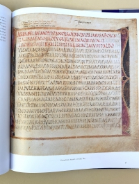 Text page in red and black rustic capitals of a particularly elegant type. Reproduced from Wright, The Roman Vergil (2001).