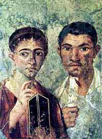 A fresco of a Pompein couple with stylus, wax tablets, and papyrus scroll, preserved in the Museuo Archeologico Nazionale. (View Larger)