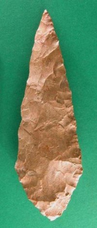 A silcrete stone tool from Blombos Cave in South Africa, finished with pressure flaking. (View Larger)