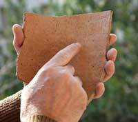 A shard of ancient pottery found in the Elah Fortress, bearing Proto-Canaanite script which might compose the earliest known Hebrew inscription. (View Larger)