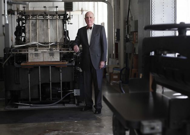 Andrew Hoyem in front of a printing press.