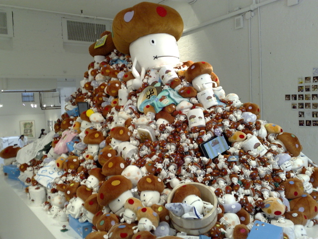 A large pile of Docomodake merchandise. Docomodake is the mascot of NTT DoCoMo and is a very popular character in Japan