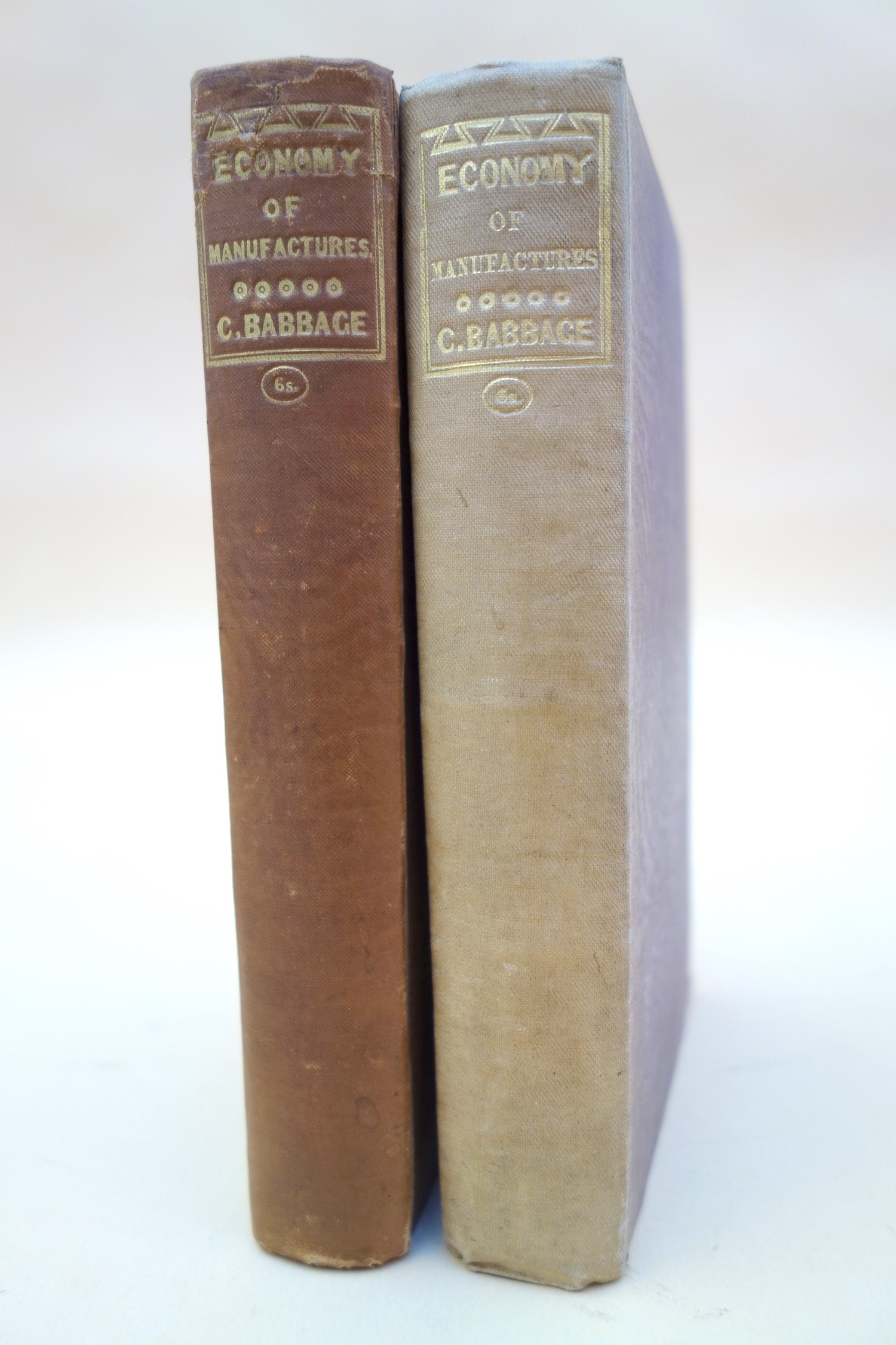The decorated spines of the first and third editions of Babbage