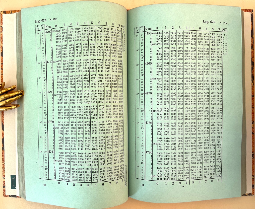 Page opening of Babbage's tables printed on green paper.