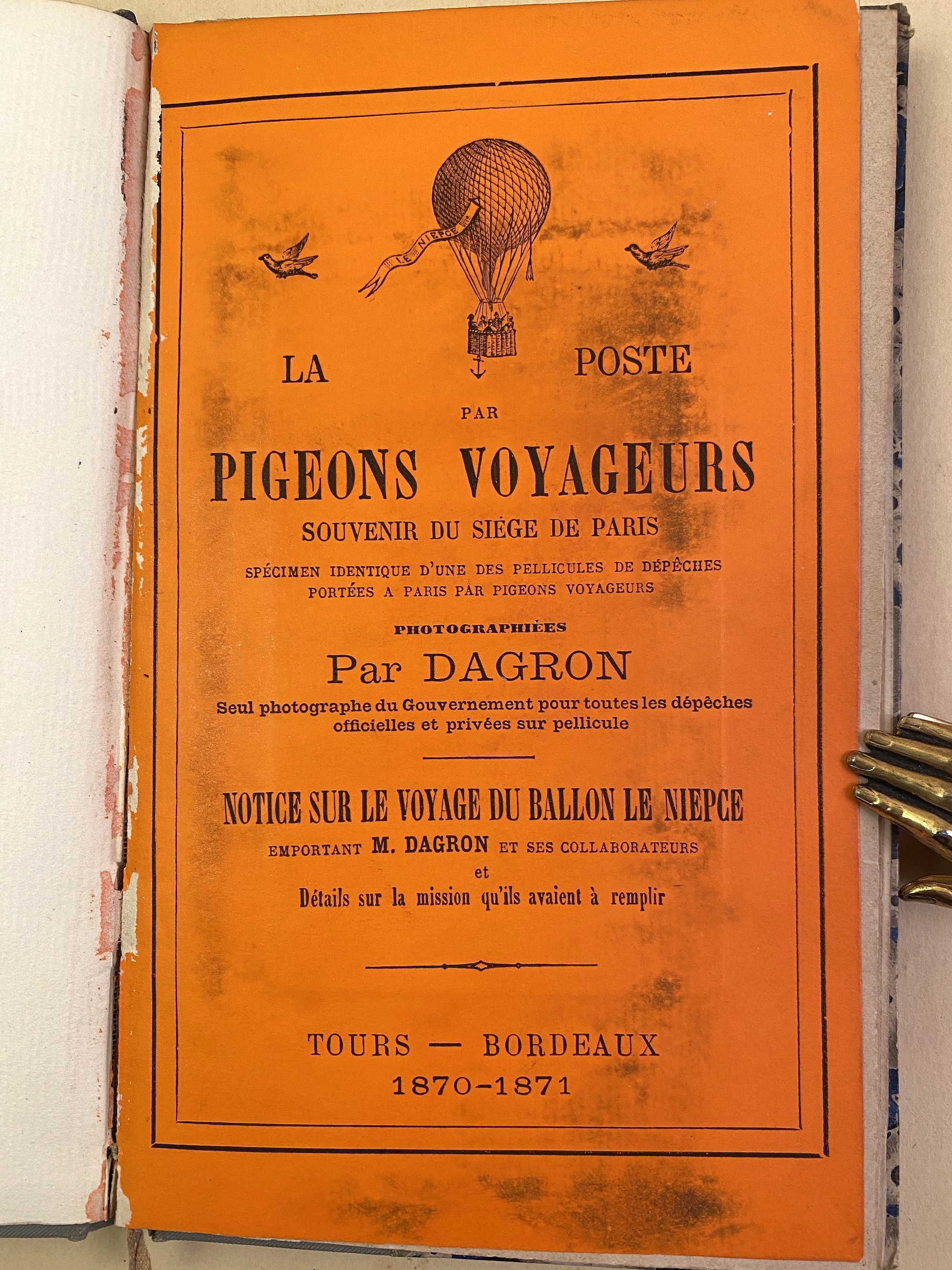 Orange printed wrapper of Dagron's pamphlet on the pigeon post.