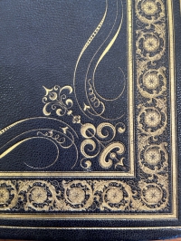 From this enlargement of the right lower corner of the upper cover of the binding you can see the exquisite detail of the ornamentation of the binding, derived from Derriey's designs and type