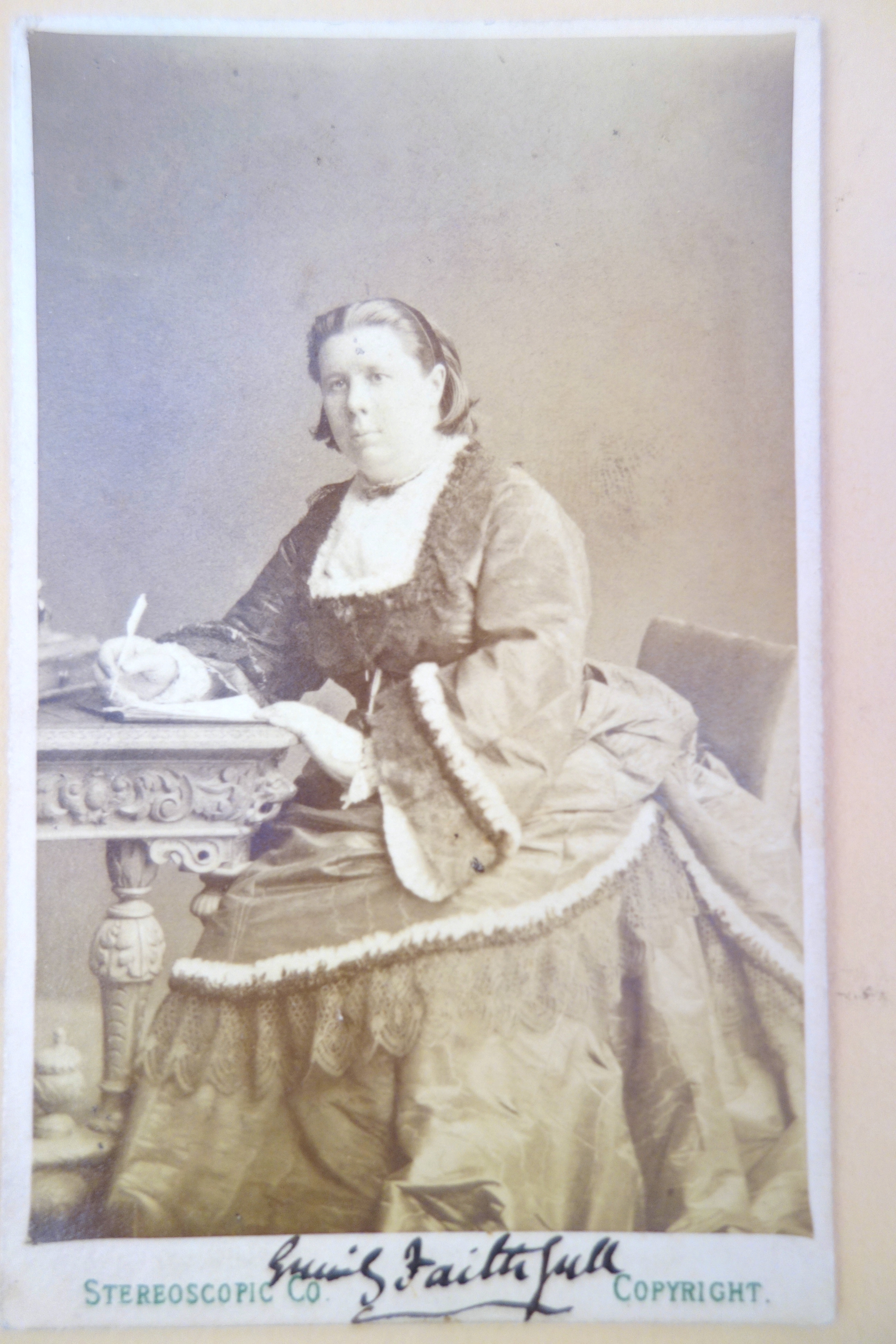 Carte de visit photograph of Faithfull with her autograph in the lower margin.