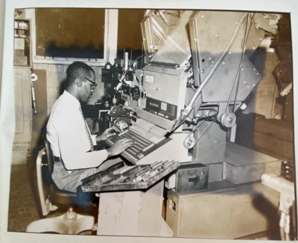 Composing. The machine appears to be a late model Linotype. Composing. The machine appears to be a late model Linotype.