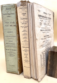 The publishers supplied a protective cardboard wrapper to hold vols. 1 and 2 together. The inside of spine of the protective covers contain a series of vertical strings through which owners c