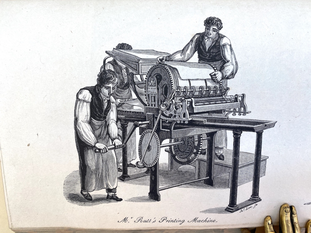 Hansard's excellent plate of Rutt's printing machine being driven by a hand-crank.