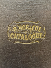 The logo stamped in the center of the upper cover of Hoe's 1873 large quarto format catalogue.