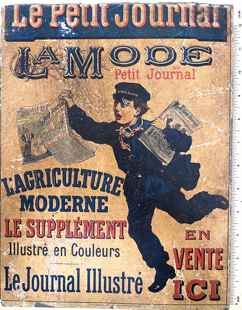 Street vendor sign for Le Petit Journal, circa 1900. Note the special uniform worn by the newsboy.