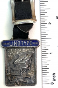 A Linotype watch fob probably intended for a pocket watch.