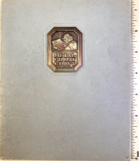 The cover of the Metal Print Craft brochure showing the placement of the embossed metal emblem.