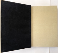 A very distinctive feature of this designer binding are the black swede pastedown endpapers.