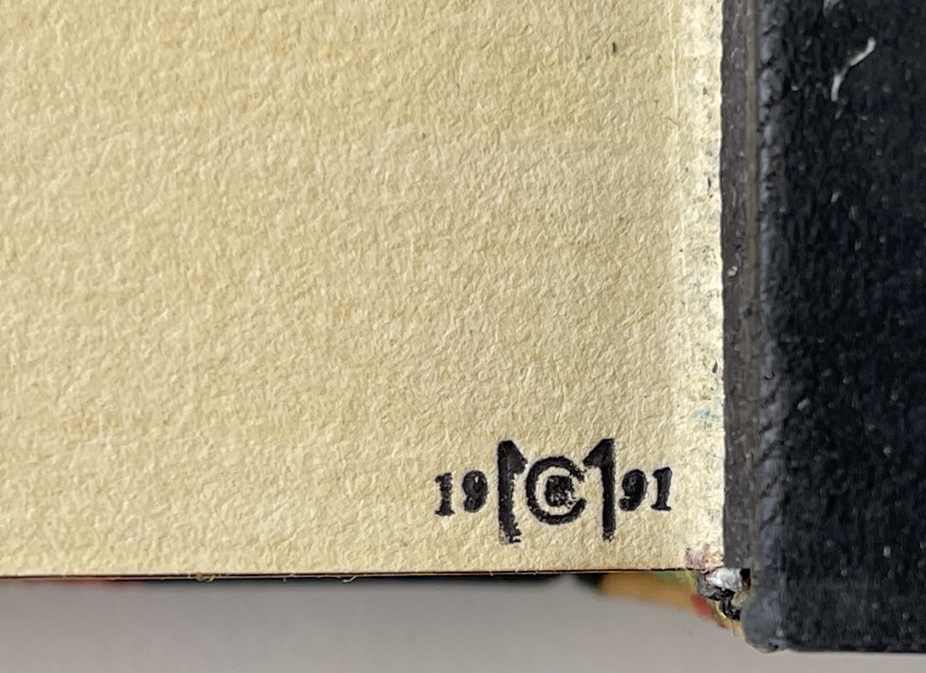 Enlargement of Middleton's small stamp at the foot of the rear free endpaper. Because of the coarse surface on the handmade paper the initial B (inside the C) did not print clearly on the sma