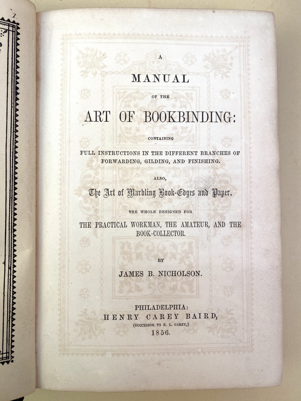 The offsetting of the ink from the binding design on the frontispiece of this copy of the original edition makes an attractive design on the title page.