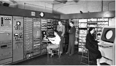 Stephen Dodd, Jay Forrester, Robert Everett, and Ramona Ferenz at Whirlwind I test control in the Barta Building, 1950. The 16-inch  Whirlwind Display Console used by Ferenz was the first com