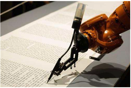A robot writes a Torah at an installation in the Jewish Museum in Berlin.