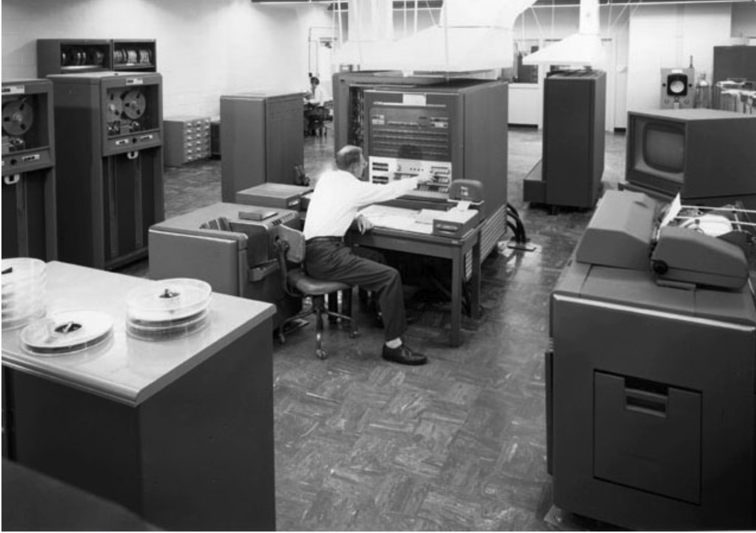 "The IBM 704 Computer (1954). The first mass-produced computer with core memory and floating-point arithmetic, whose designers included John Backus, formerly of IBM Watson Laboratory at Columbia University (who also was the principal designer of FORTRAN, the first widespread high-level language for computer programming), as well as Gene Amdahl (who would go on to become chief architect for the IBM 360 and later start his own company to rival IBM). The 704