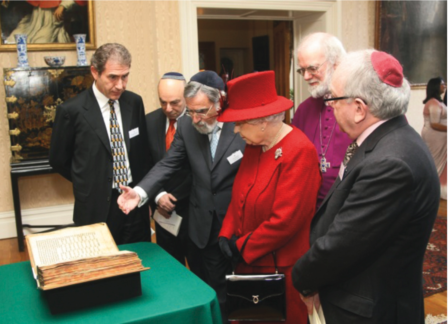 Queen Elizabeth II, Chief Rabi Lord Jonathan Sacks and Archbishop of Canterbury Rown Williams, viewing Valmdonna Codex I in Lambeth Palace in honor of the Queen Diamond Jubilee, 15 February 2012.