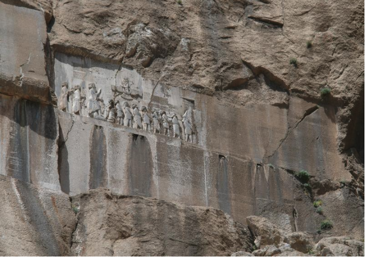 Behistun inscription and reliefs from a distance.