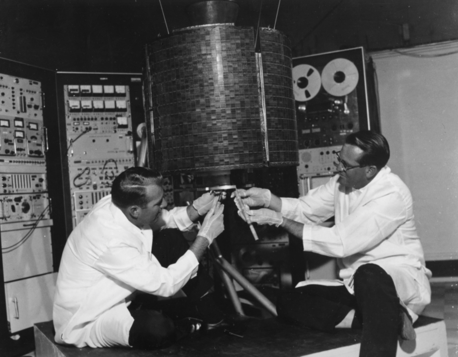 Engineers Stanley R. Peterson (left) and Ray Bowerman (right), checkout the Early Bird, the world