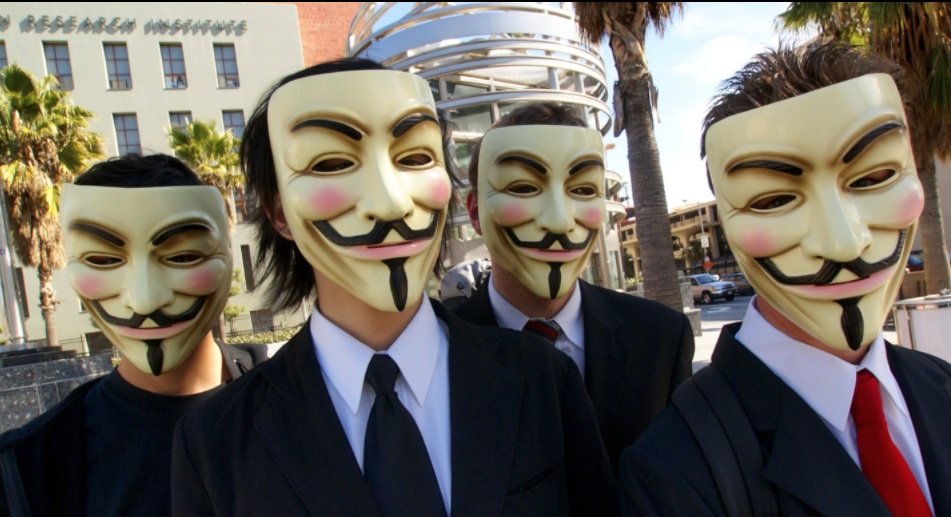 People from the Anonymous hactivist group wearing Guy Fawkes masks near the Scientology facility in Los Angeles