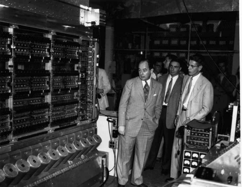 John von Neumann and guests in front of the Princeton IAS machine.