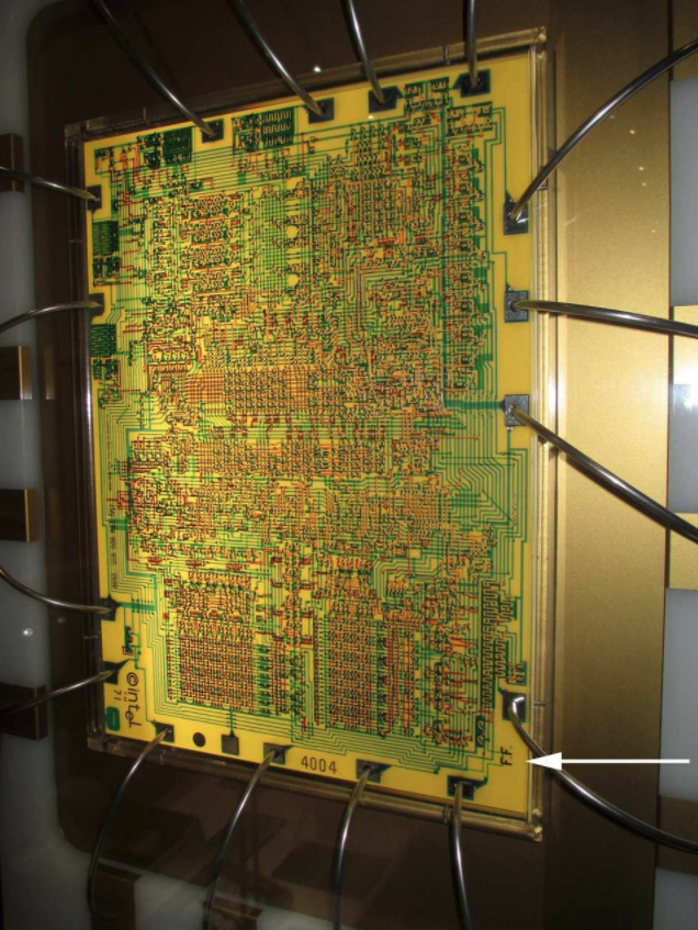 Greatly enlarged circuitry of the Intel 4004 showing Federico Faggin's initials (FF) in the lower right corner.