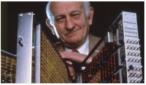 John Cocke with the RISC architecture computer that he invented.