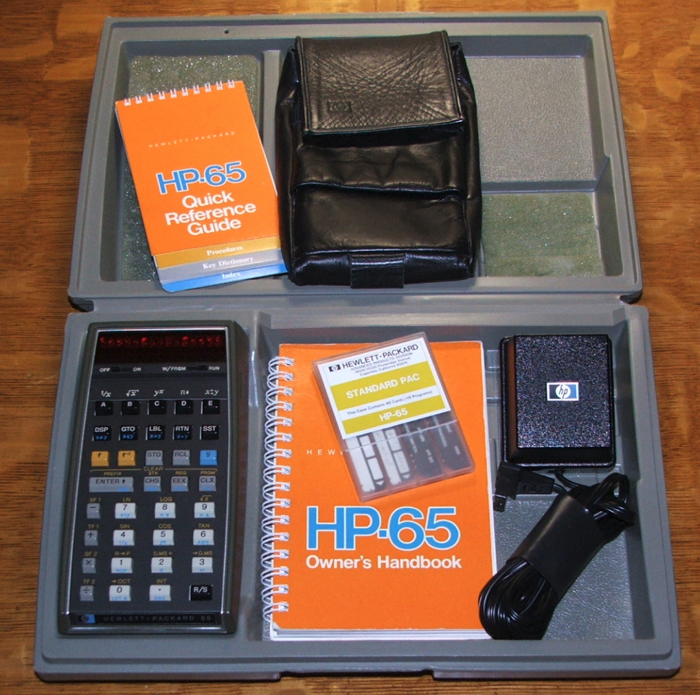 HP-65 in original hard case with manuals, software "Standard Pac" of magnetic cards, soft leather case, and charger