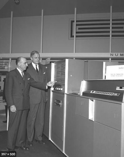 Thomas J. Watson Jr. (Right) examining IBMs first all-transistorized computer, the IBM 608 Calculator, December 1956.