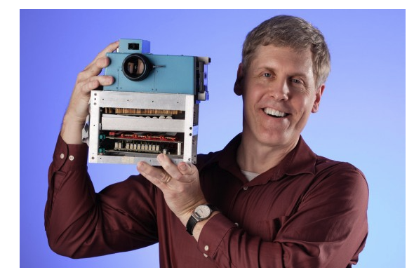 Steven Sasson holding the original digital camera prototype