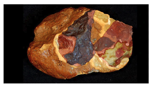 photo of A silcrete nodule showing experimental changes in texture and color resulting from exposure to heat.
