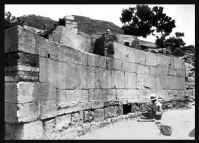 An old photograph that shows the arrangement of the stones in their semi-circular wall before the modern protective shelter was built over the inscription.