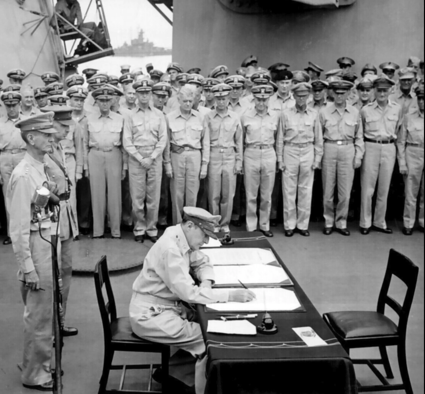 General of the Army Douglas MacArthur signing the Instrument of Surrender on behalf of the Allied Powers
