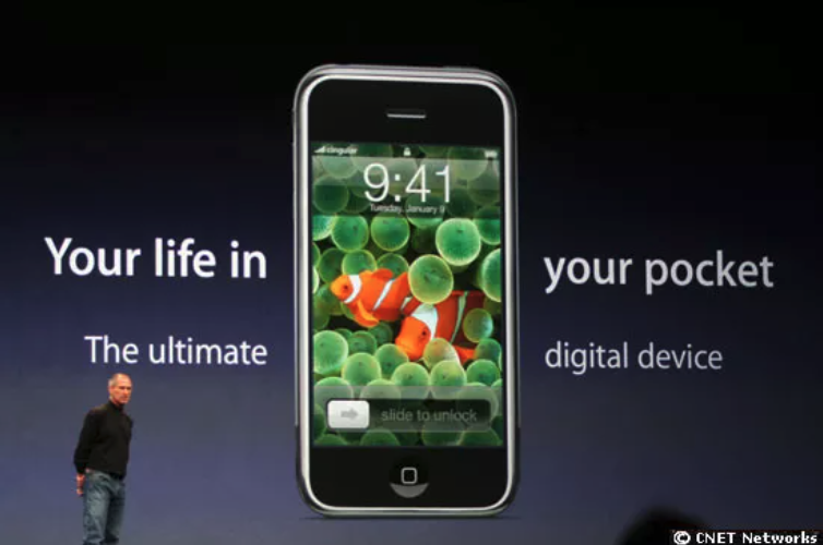Steve Jobs with iPhone. Your life in your pocket.