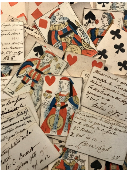 The backs of playing cards used for library cataloguing. In this set published after the French Revolution the crowns on members of the royal house have been removed.