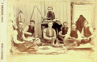 This cabinet-size photograph shows a senior tailor using a Howe sewing machine from about 1870.