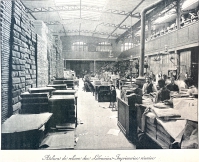 A more general view of the bookbindery of the Librarie-Imprimerie réunie. The machine for gildng and printing bookcovers (shown in the previous photograph) is in far background of the image.